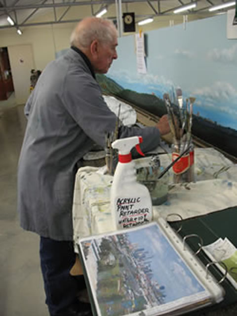 Owen Robinson painting Scenery for AMRA (Q)'s Club Layout "Mayne"